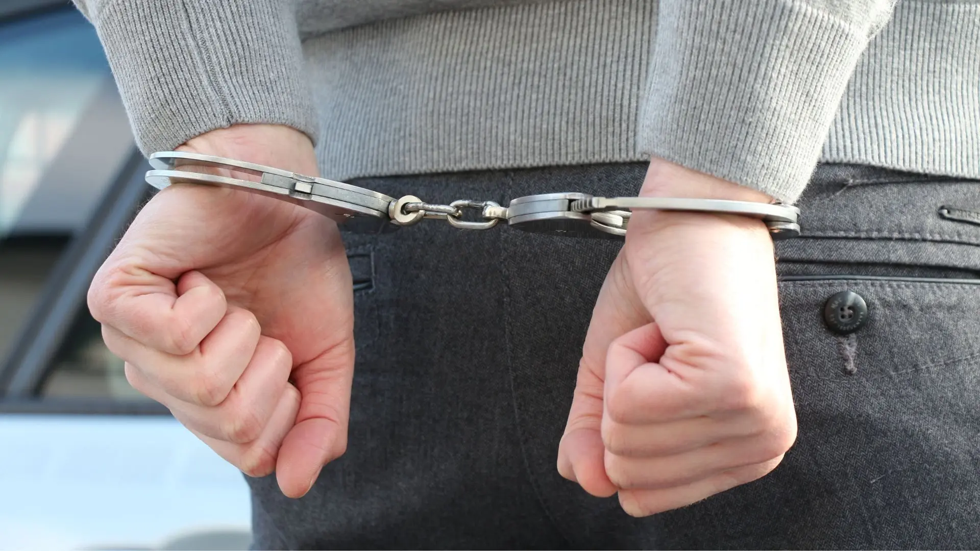 hands-in-handcuffs-behind-the-back