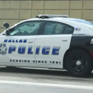 Dallas^ Texas - September 20^ 2018 a police car heading for downtown dallas