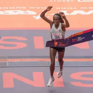 Hellen Obiri of Kenya crossing finish line with time 2:27:23 as a winner of TCS New York City marathon in open women's division in Central Park in New York on November 5^ 2023