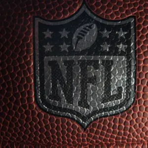 Closeup of an NFL logo on an American football