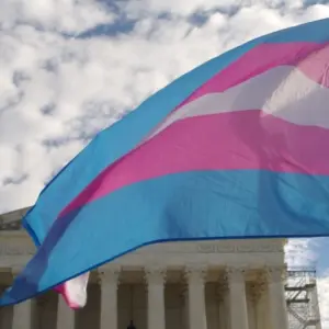 A transgender pride flag flies in front of the U.S. Supreme Court building in Washington^ DC.