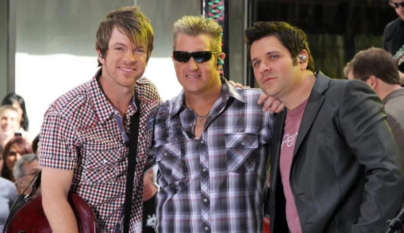 Guitarist Joe Don Rooney^ singer Gary Levox and bassist Jay DeMarcus of Rascal Flatts perform on NBC's Today Show in Rockefeller Plaza on June 11^ 2010 in New York City.