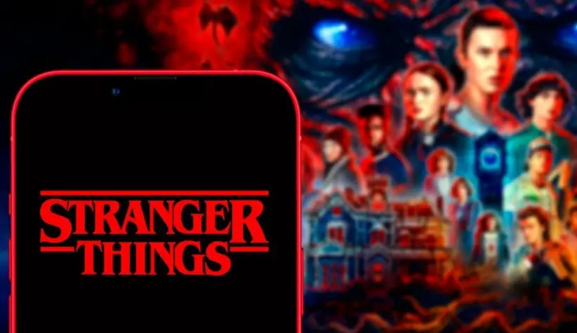 phone 11 pro with the Stranger Things logo. Stranger Things is an American web series of suspense and science.