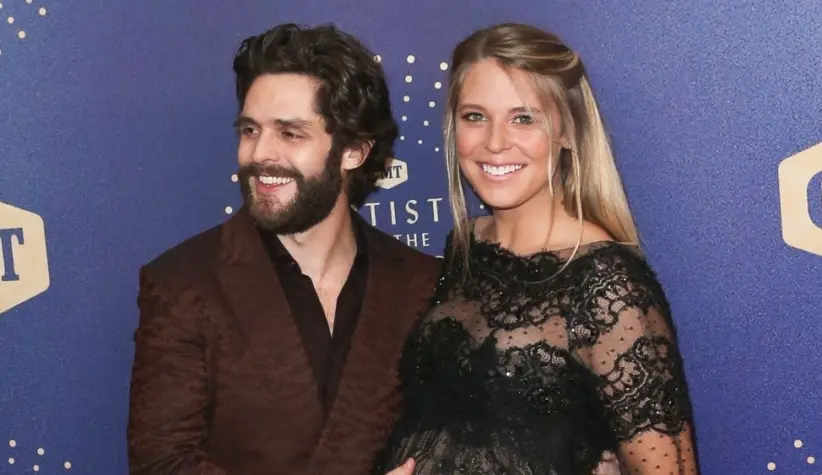 Thomas Rhett (L) and wife Lauren Akins attend the 2019 CMT Artists of the Year at Schermerhorn Symphony Center on October 16^ 2019 in Nashville^ Tennessee.