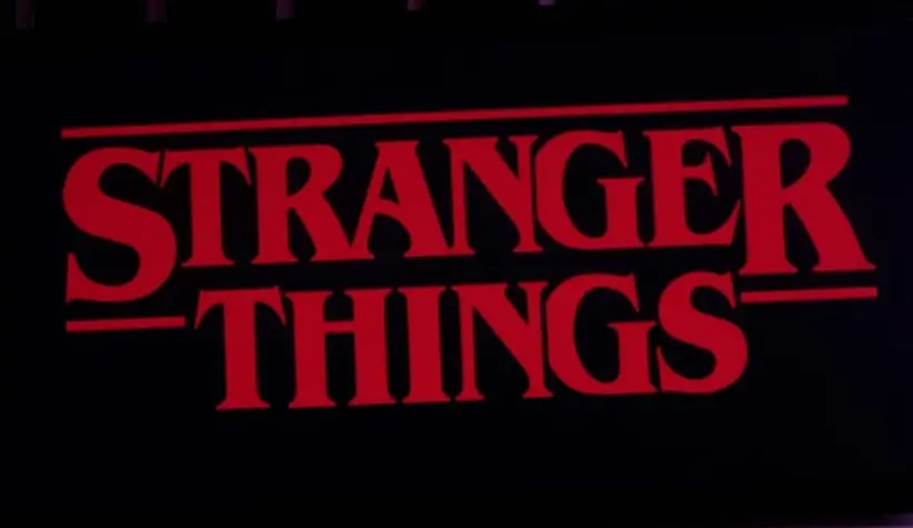 Iphone 11 pro with the Stranger Things logo on top of a computer keyboard. United States^ New York. Sunday^ September 29^ 2019.