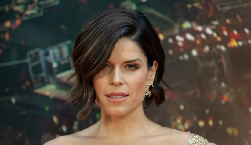 Neve Campbell wearing dress by Barney Cheng Couture attends the premiere of Skyscraper at AMC Loews Lincoln Center New York^ NY - July 10^ 2018