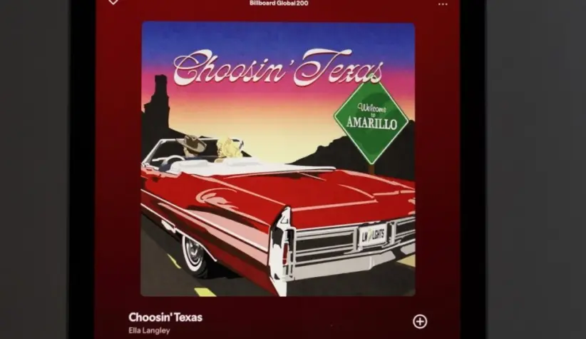 Apple iPad displays the Spotify music streaming application^ which is playing the song 