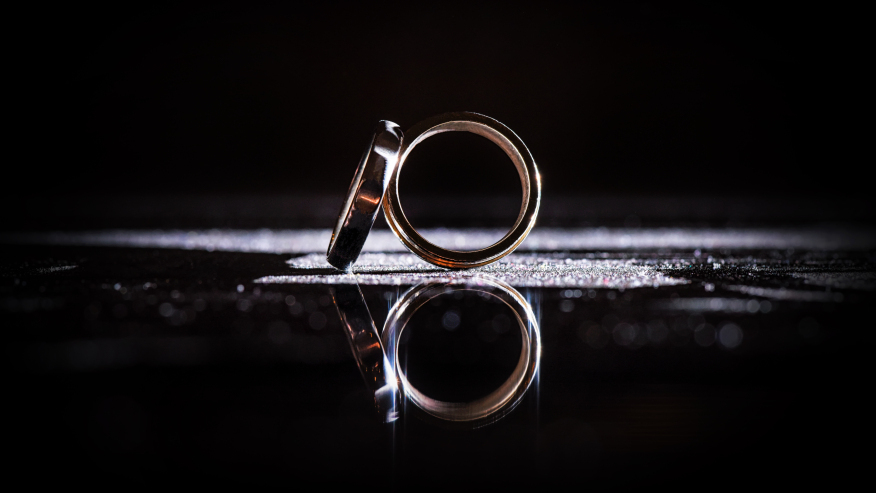 wedding-bands-reflected-on-a-black-surface
