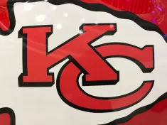 Closeup of Kansas City Chiefs helmet^ white and red^ displaying 'KC' logo