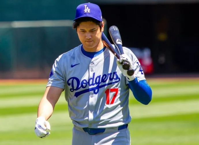 Los Angeles Dodgers designated hitter Shohei Ohtani walk on the field before a game against the Oakland Athletics at the Oakland Coliseum. Oakland^ California - August 4^ 2024