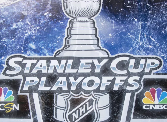 Stanley Cup Playoffs logo displayed at the NBC Experience Store window in midtown Manhattan