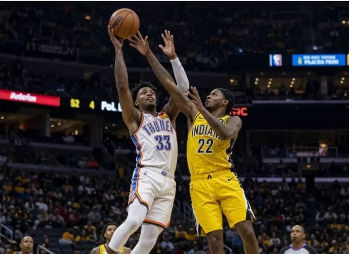 Realistic photography of two basketball players fighting in the air to catch the ball falling after a failed shot in an nba game. one basketball player is from the oklahoma city thunder and the other basketball player is from the indiana pacers. the photo