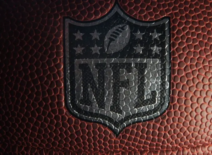 Closeup of an NFL logo on an American football