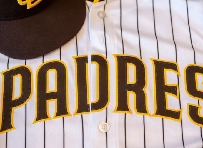San Diego Padres baseball hat and team jersey.