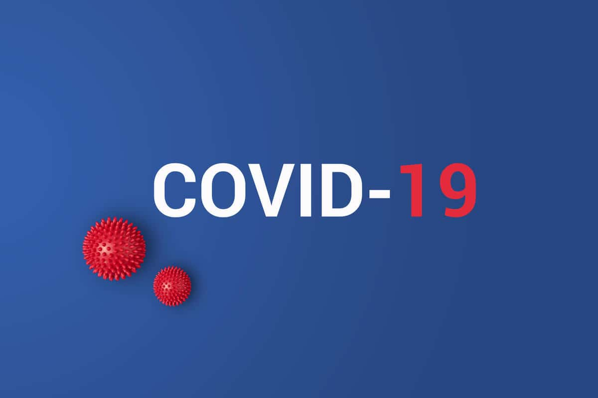 iinscription-covid-19-on-blue-background-with-red-ball