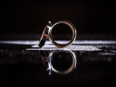 wedding-bands-reflected-on-a-black-surface