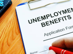 man-fills-in-unemployment-benefits-application-form