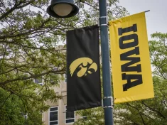 University of Iowa banner with Hawkeyes logo on college campus. Iowa City^ IA - May 23^ 2022: