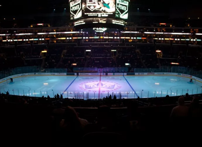 pro ice hokey rink lit up at nighttime