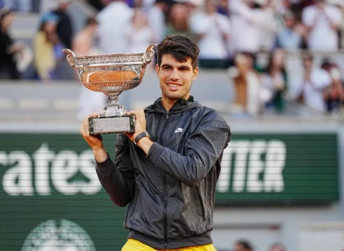 Roland Garros champion Carlos Alcaraz of Spain during trophy presentation after men's final match victory against Alexander Zverev of Germany in Paris^ France. PARIS^ FRANCE - JUNE 9^ 2024
