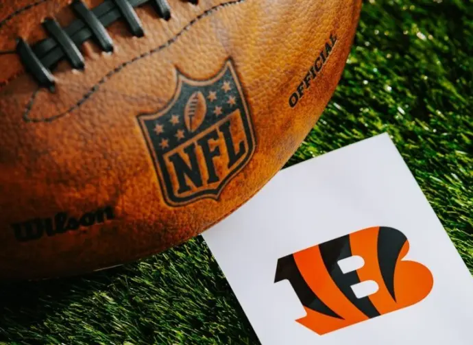 Cincinnati Bengals NFL team Logo and American football ball on Green Grass. CINCINNATI^ USA^ FEBRUARY 10^ 2025