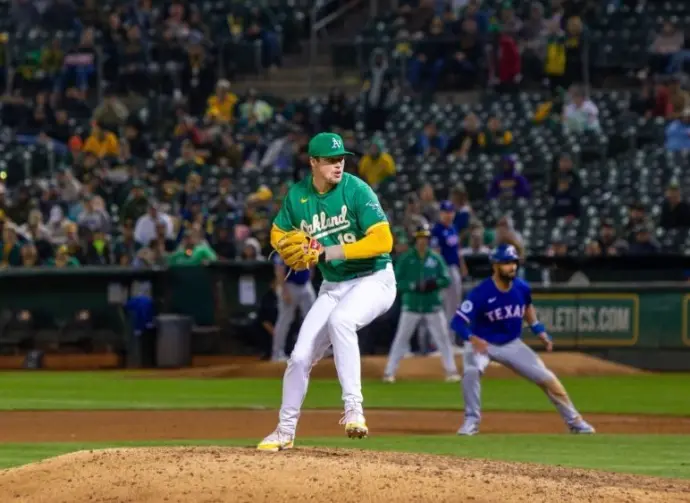 Oakland Athletics pitcher Mason Miller pitches against the Texas Rangers at the Oakland Coliseum. Oakland^ California - September 24^ 2024