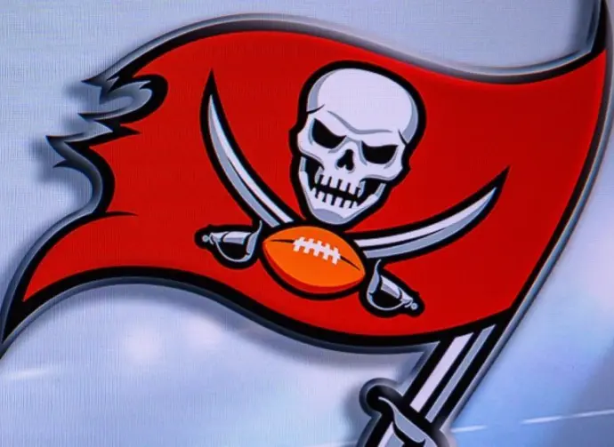 LOGO OF Tampa Bay Buccaneers. American football match^ silhouette of players.