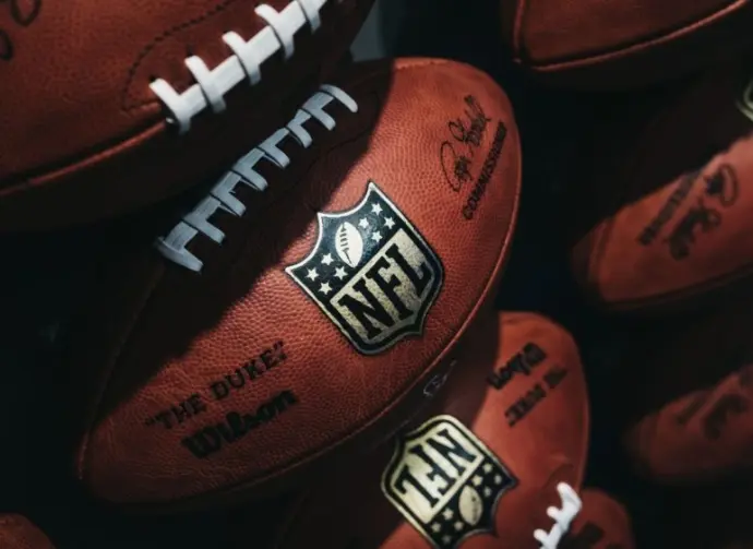 Rows of american football balls in NFL Experience in Times Square^ New York.