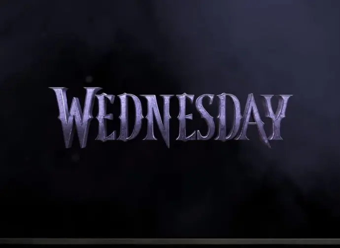 TV on black wall. TV screen playing Netflix series 'Wednesday' trailer