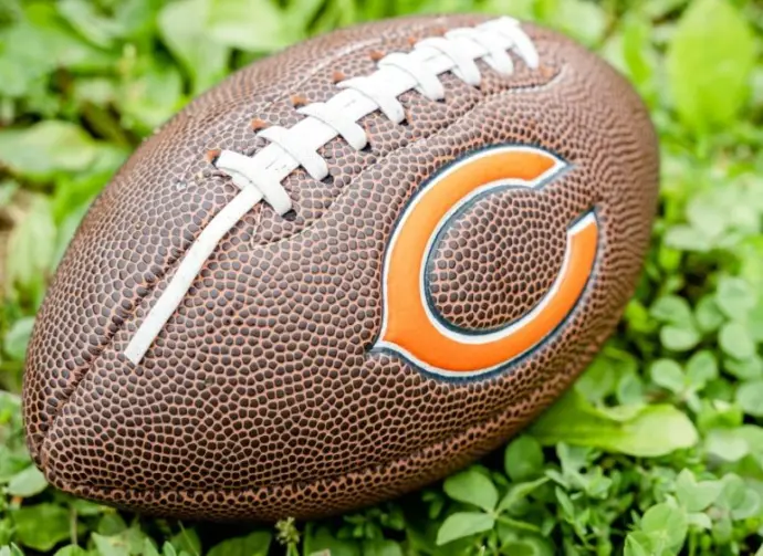 Football with Chicago Bears logo the on grass. Chicago Bears of the National Football Conference North. Rockford^ WI / USA.- Feb 12^ 2019