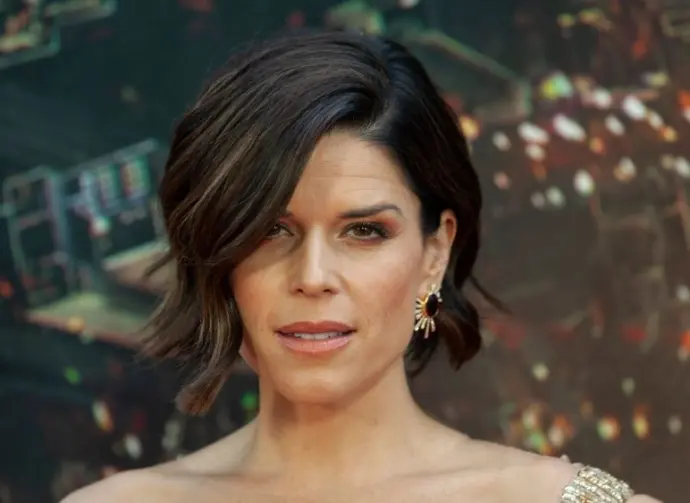 Neve Campbell wearing dress by Barney Cheng Couture attends the premiere of Skyscraper at AMC Loews Lincoln Center New York^ NY - July 10^ 2018