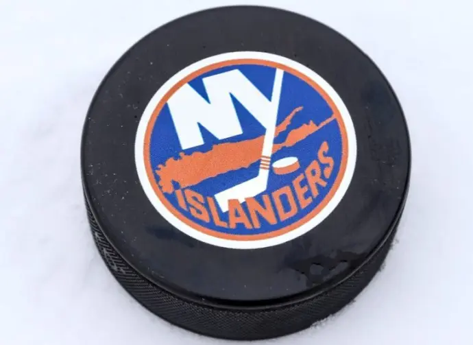 New York Islanders logo on Ice hockey puck outdoors in snow OREBRO^ SWEDEN - FEBRUARY 3^ 2019