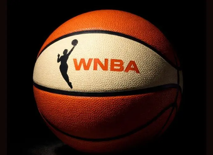 AI Generated photo featuring basketball with the WNBA logo^ background is completely black with ball illuminated artistically. (This content was generated by an Artificial Intelligence (AI) system.)