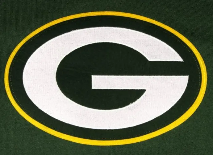 The Green Bay Packers emblem on a team sweatshirt. GREEN Background