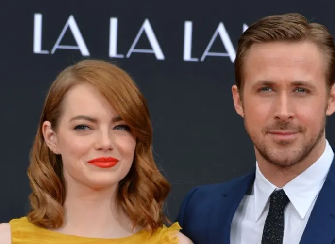 LOS ANGELES^ CA - DECEMBER 7^ 2016: Actors Emma Stone & Ryan Gosling at the TCL Chinese Theatre^ Hollywood^ where the stars of La La Land had their hand & footprints set in cement.