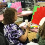 Kathy: Kathy Davis (news/copy/60 Seconds to a Healthier You) choosing to go bold with her flower