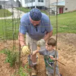 James Yates: James Yates

"Papa teaching Grandson how to stake tomato cages. "