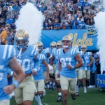 UCLA players run out of the tunnel before an NCAA college football game between the UCLA and the Colorado^ Oct. 28^ 2023^ in Pasadena^ Calif.