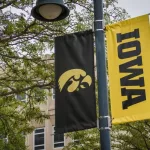 University of Iowa banner with Hawkeyes logo on college campus. Iowa City^ IA - May 23^ 2022: