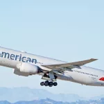 American Airlines Boeing 777-223(ER) aircraft is airborne as it departs Los Angeles International Airport. Los Angeles^ California USA