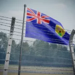 Barbed wire fence and flag of Turks and Caicos Islands - border concept - 3d illustration