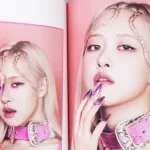 BlackPink BORN PINK 2nd Album photobook with Rose on grey. Pink music CD in player. South Korean girl group BlackPink. Space for text. Gatineau^ QC Canada - November 10 2022.