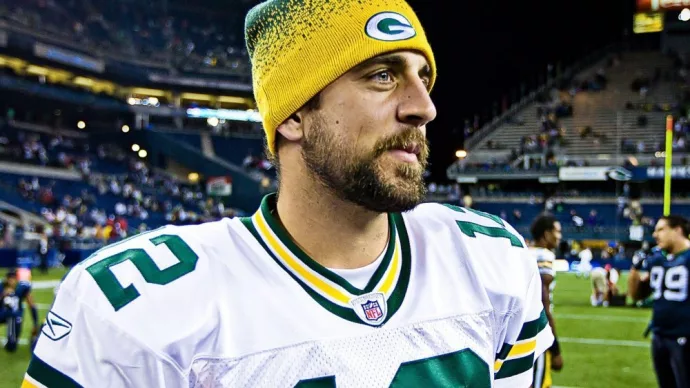 Quarterback Aaron Rodgers walks on Qwest Field after winning a football game August 21^ 2010 in Seattle^ Washington.