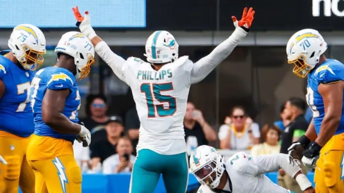 Miami Dolphins linebacker Jaelan Phillips (15) celebrates after an interception against the Los Angeles Chargers during an NFL football game^ Sept. 10^ 2023^ in Inglewood^ Calif.