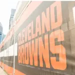 Cleveland Brown's Banner Closeup Leading To The Structural Cityscape Skyline Of Downtown Cleveland. Cleveland^ Ohio/USA - June 1^ 2019