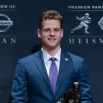 Quarterback Joe Burrow of the LSU Tigers winner of the 85th annual Heisman Memorial Trophy poses with trophy at the Marriott Marquis Hotel New York^ NY - December 14^ 2019