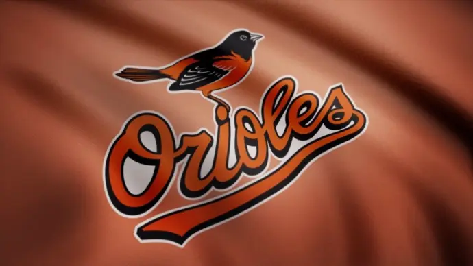WAVING flag with Baltimore Orioles professional team logo. Close-up of waving flag with Baltimore Orioles MLB baseball team logo^ seamless loop.