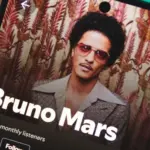 A smartphone displaying Bruno Mars's artist profile on Spotify. January 5^ 2025