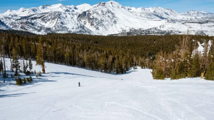 Unknown skiers have the hill to themselves at June Mountain Ski Resort^ a small resort tucked away in the Eastern Sierra Nevada mountains in California.