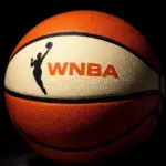 AI Generated photo featuring basketball with the WNBA logo^ background is completely black with ball illuminated artistically. (This content was generated by an Artificial Intelligence (AI) system.)